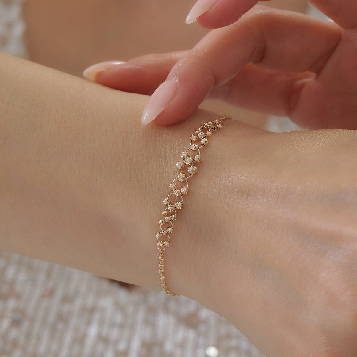 DORICA KUGEL-MIT SEILKETTEN- UND FLECHTDESIGN ARMKETTE | 14K GOLD