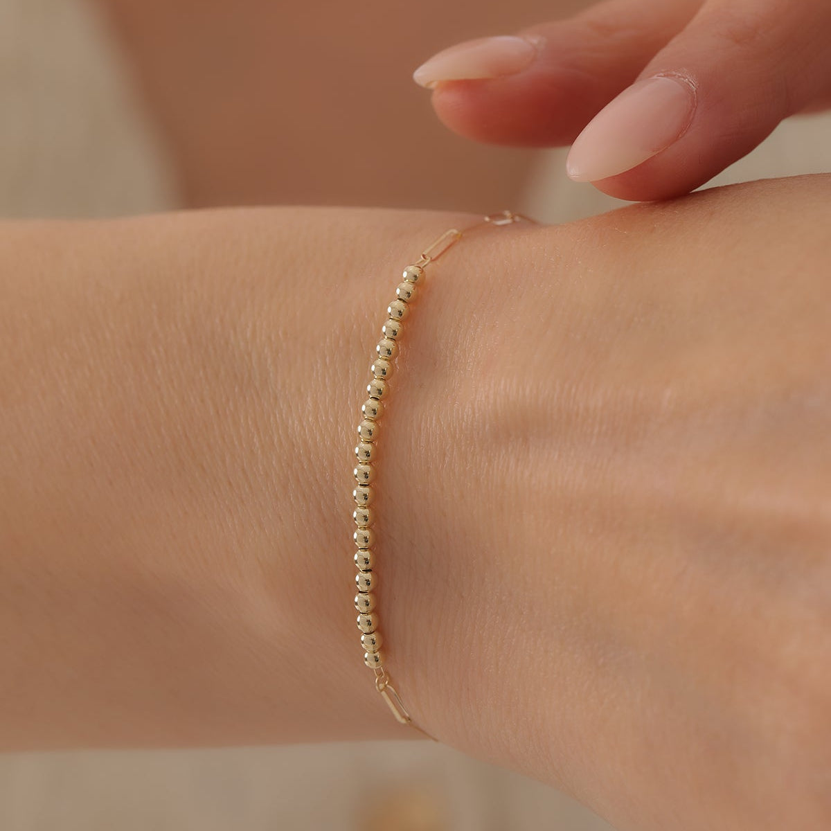 DETAILLI MINI KLAMMER- (CLIP-) DESIGN MIT KUGELN ARMKETTE | 14K GOLD