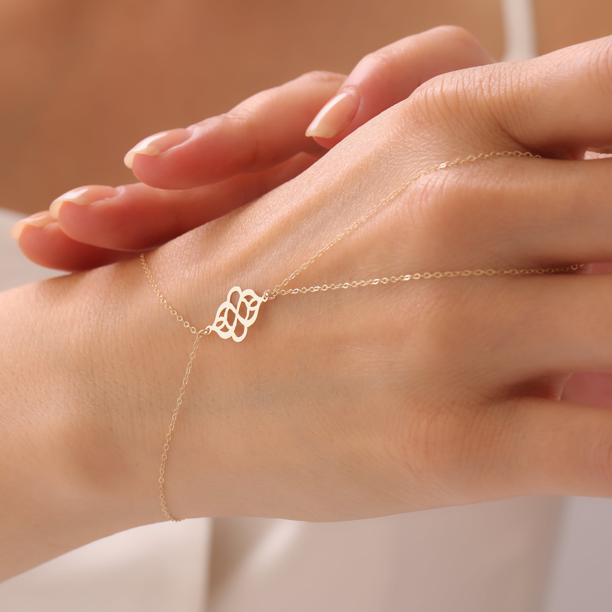 REIHENDE SCHMETTERLINGE HANDKETTE | 14K GOLD