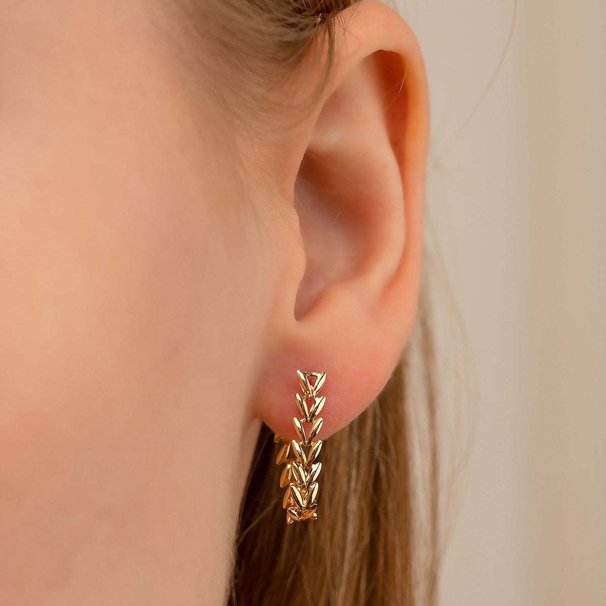 SCHWINGENDE PARS OHRRINGE | 14K GOLD