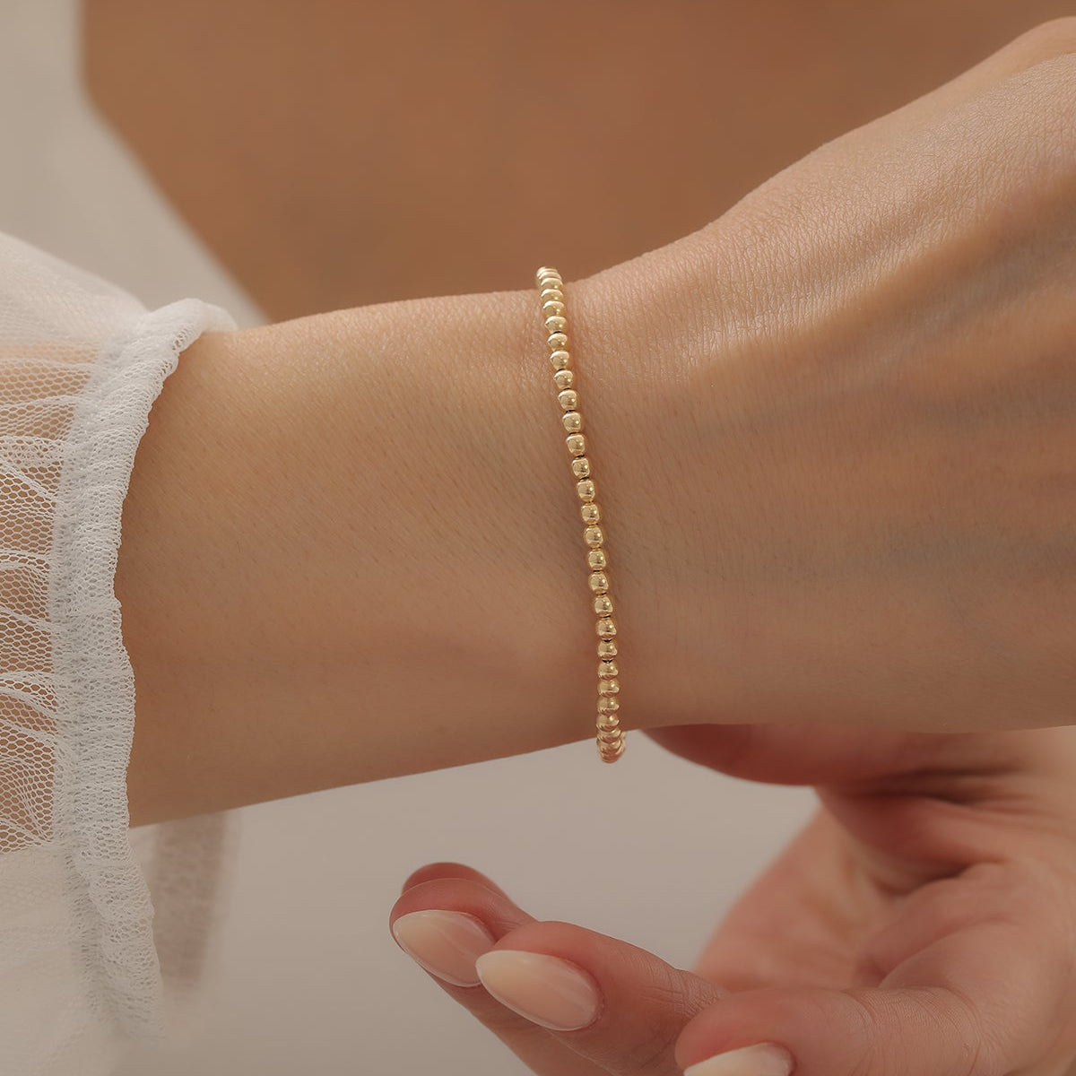 REIHENKUGEL-DESIGN ARMKETTE | 14K GOLD