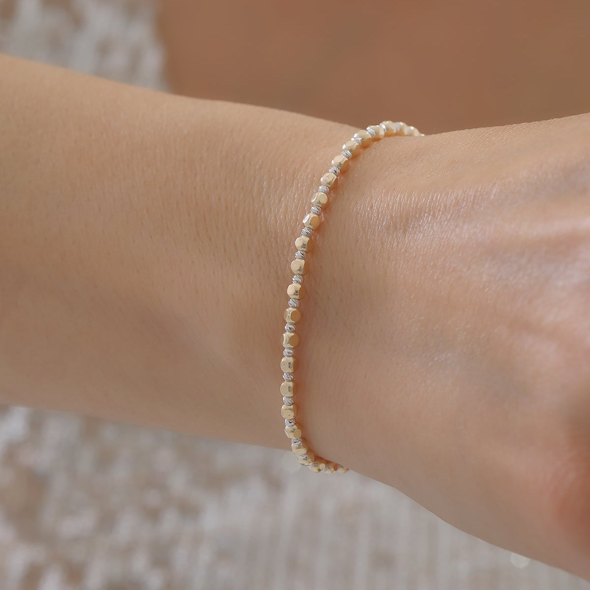 DORICA-KUGEL-REIHENOHRRINGE ARMKETTE | 14K GOLD